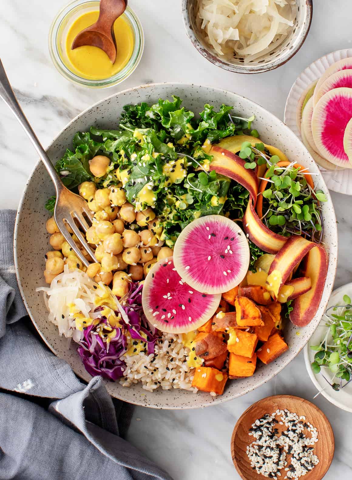 Buddha bowl with roasted sweet potatoes, kale, and brown rice