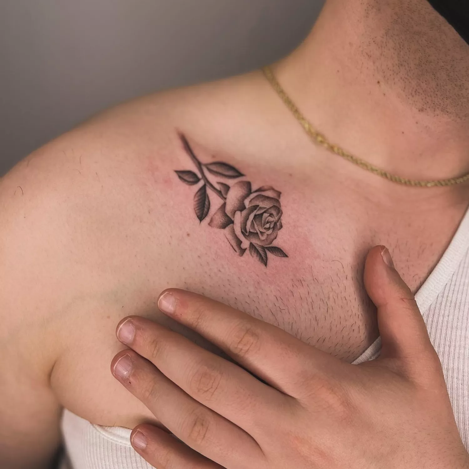 rose with stem tattoo on shoulder