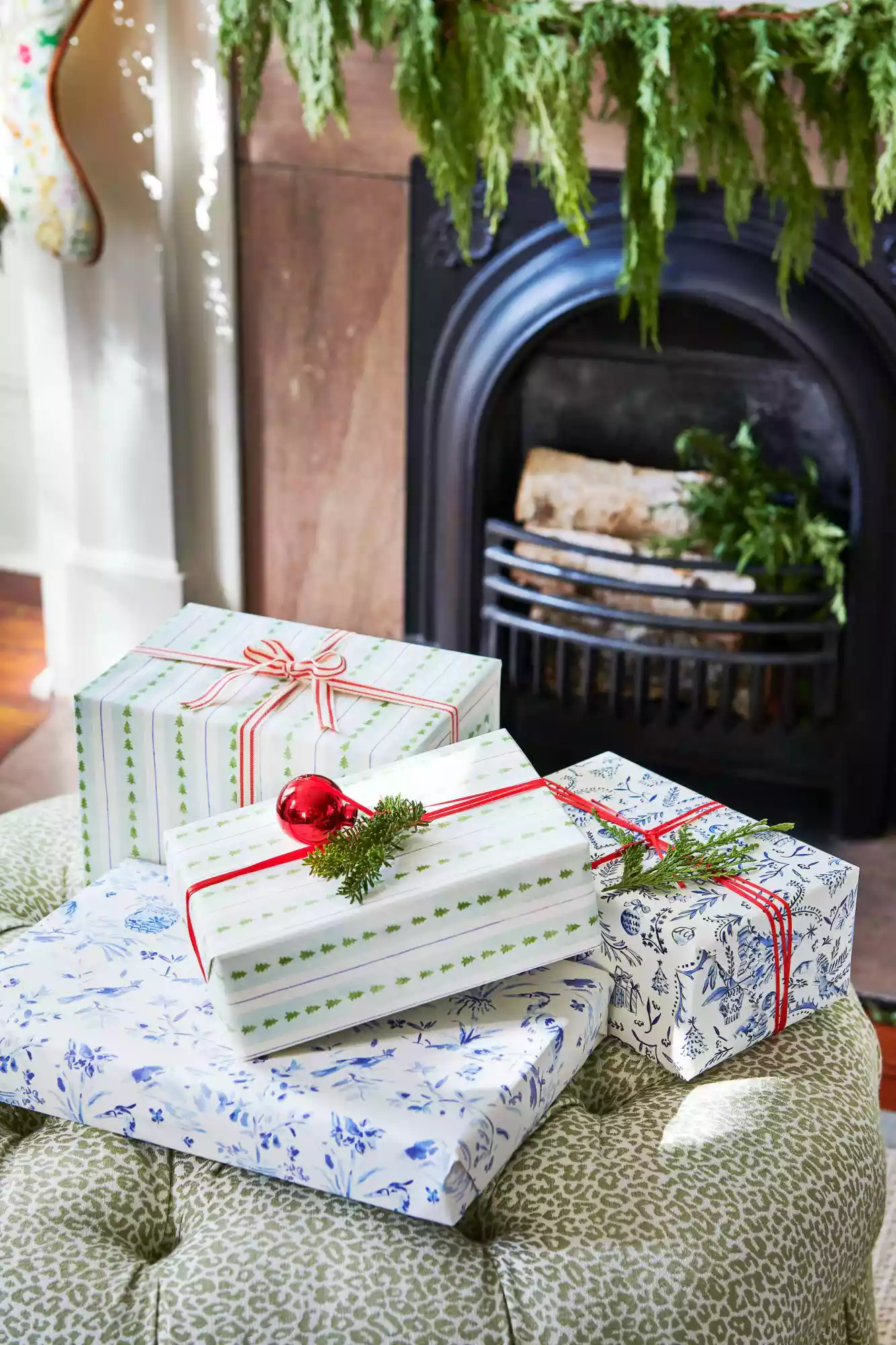 Christmas presents wrapped in green and blue paper with red ribbon.
