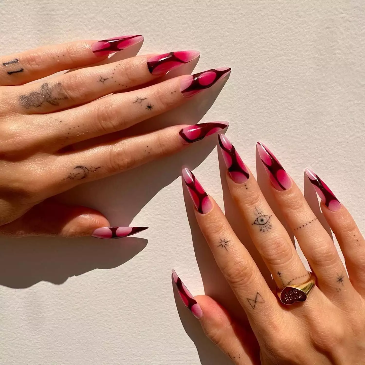 pink and black stiletto nails