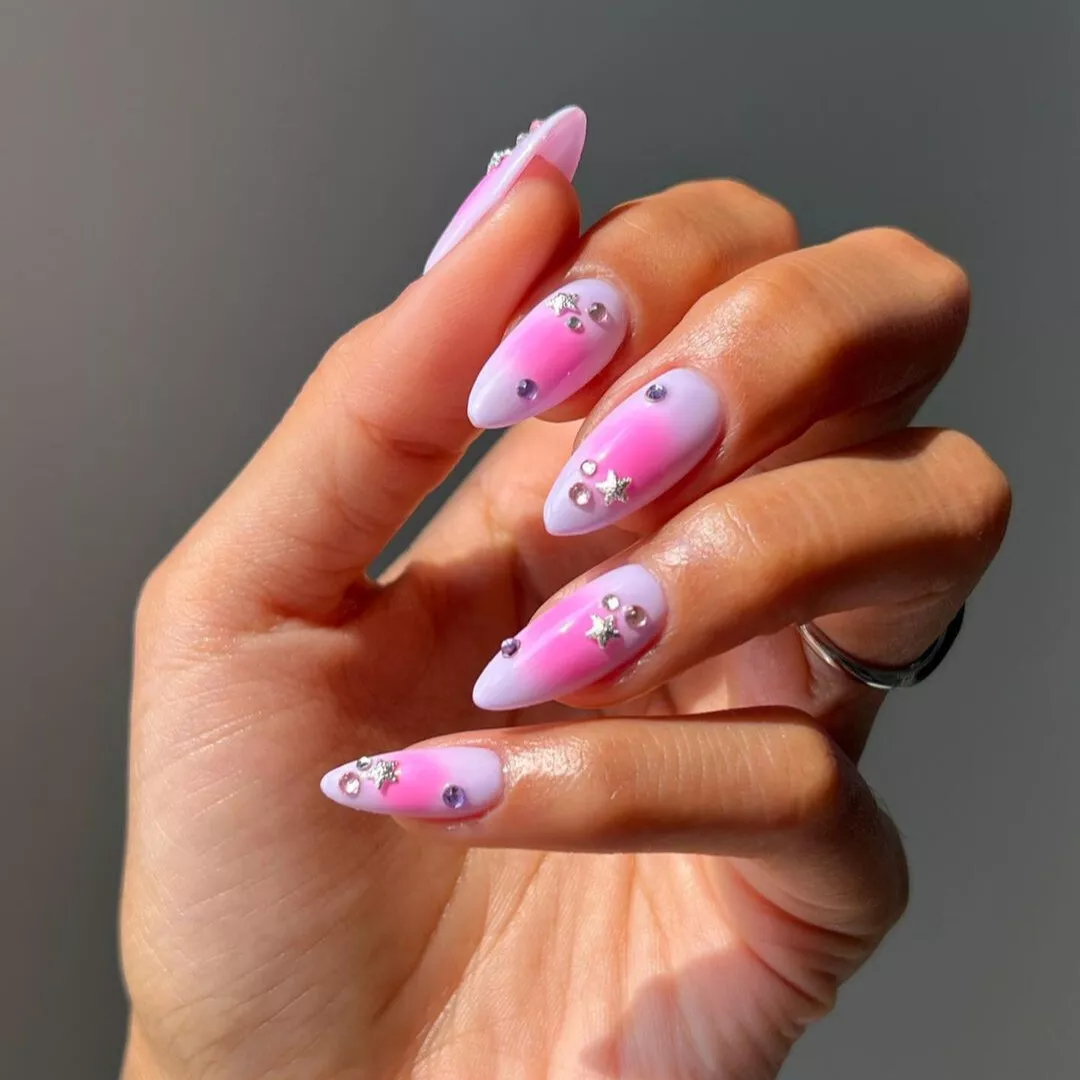 pink and lavender aura nails with star jewels and rhinestones