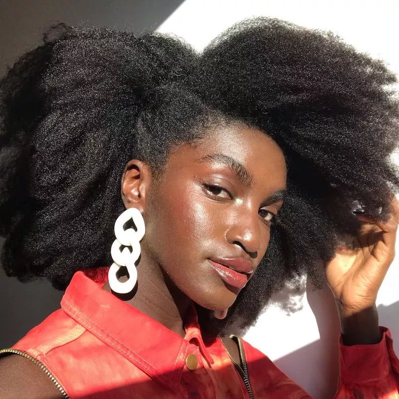 Model wears a stretched Afro hairstyle