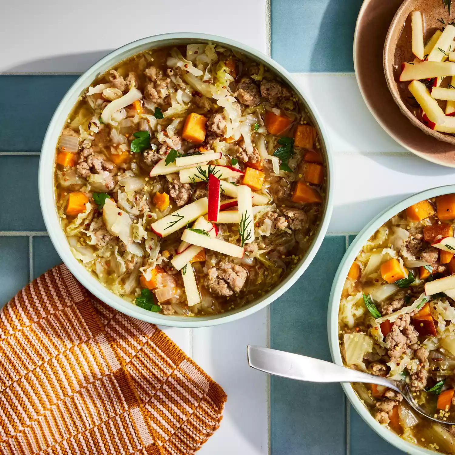 a recipe photo of the Cabbage & Sweet Potato Soup with Sausage & Mustard