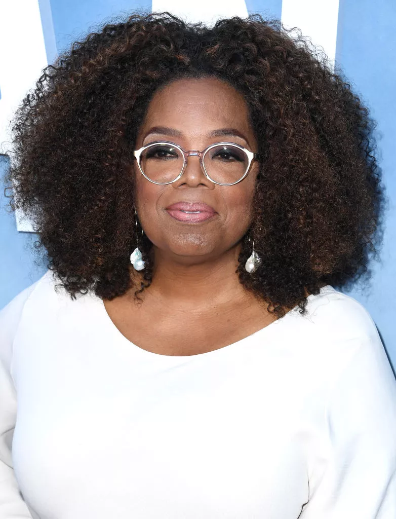 Oprah Winfrey with a Center Part afro With Volume