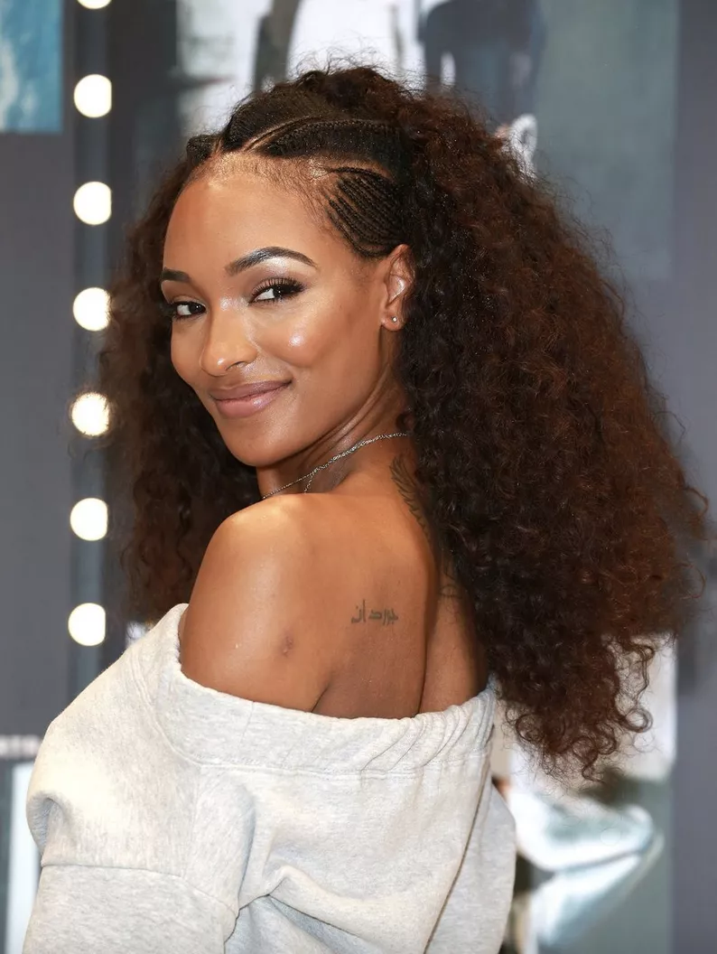 Jourdan Dunn with cornrow braids into an afro