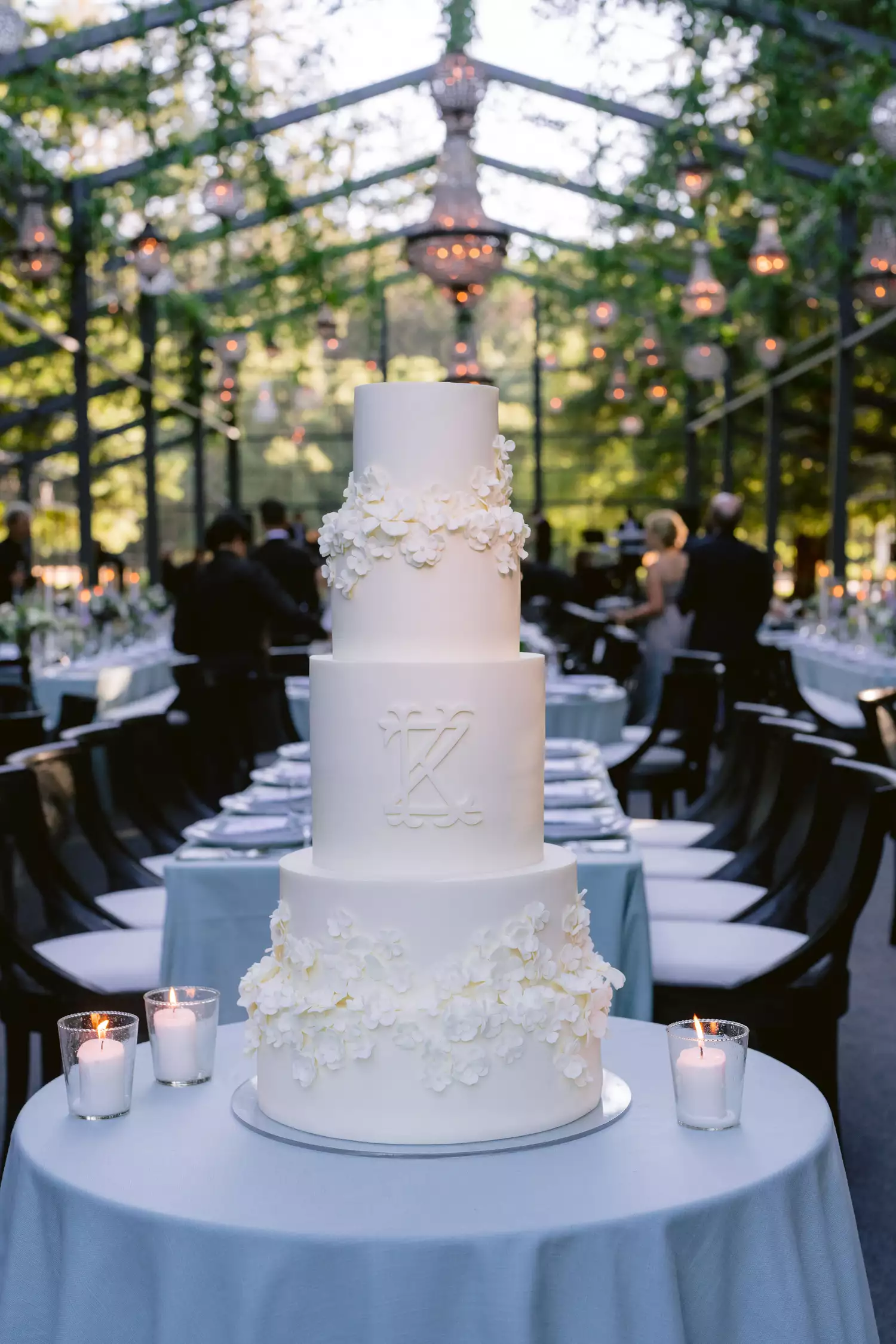 Five-Tiered White Wedding Cake with Sugar Flowers and Couple's Monogram