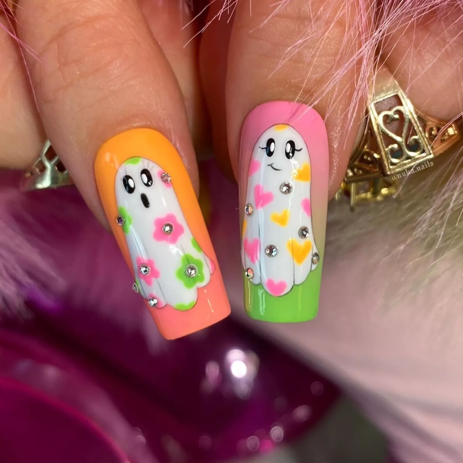 Long square nails with neon ombre and ghosts with neon hearts and flowers.