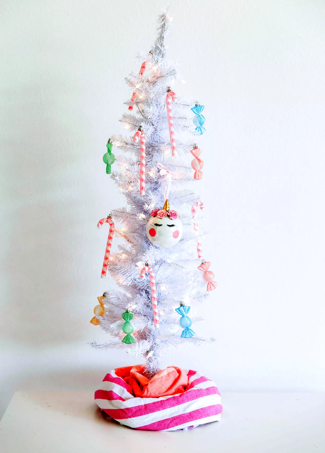 small white christmas tree with candy ornaments