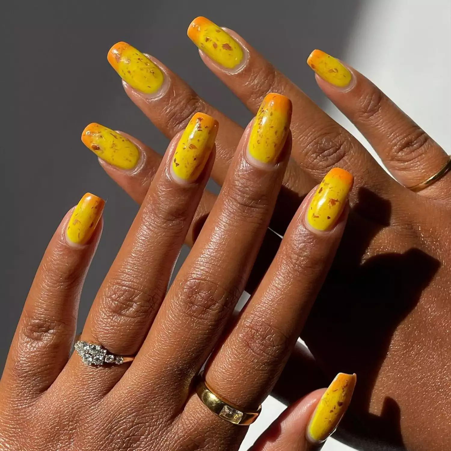 orange and yellow sunset-inspired nails