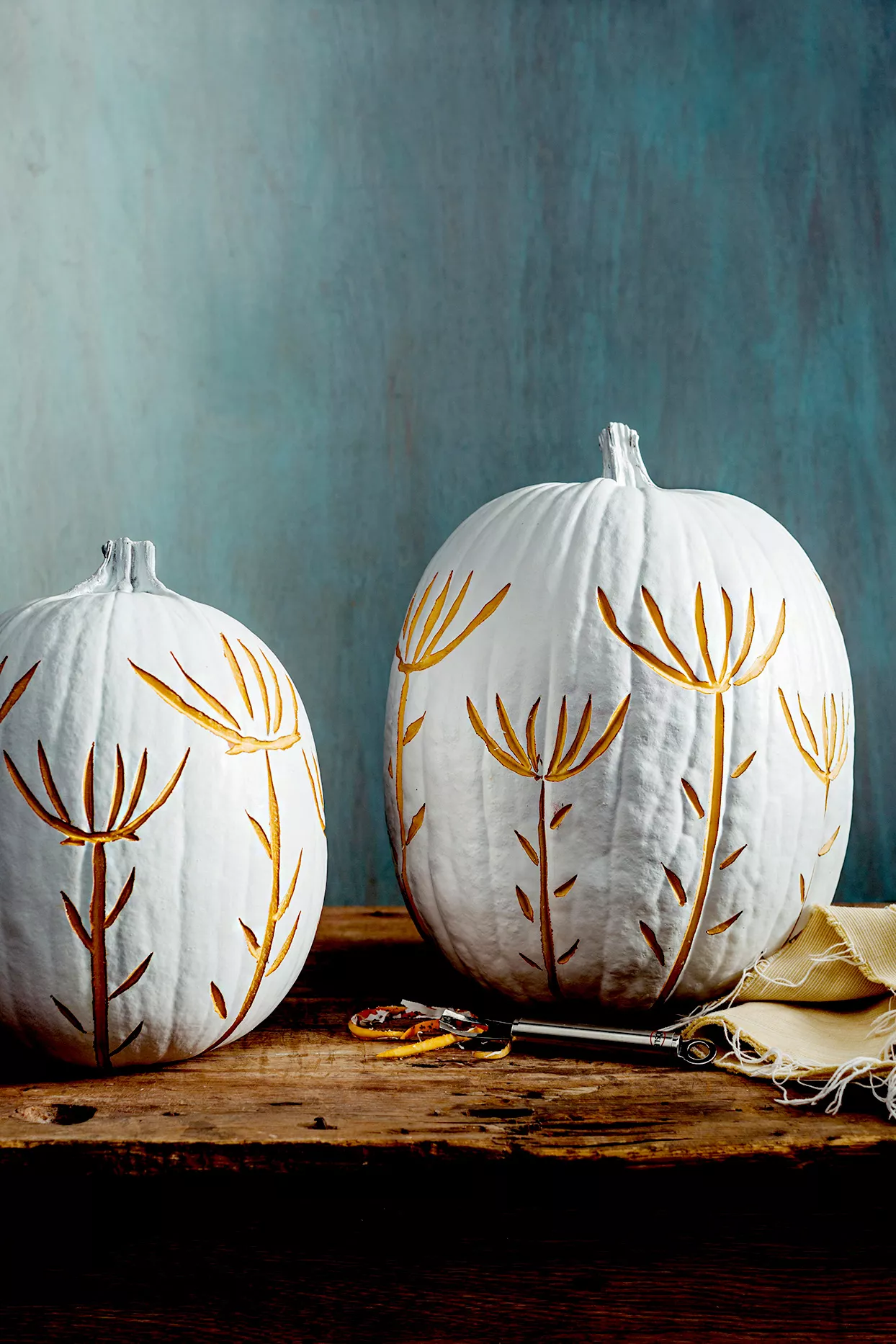 White pumpkins with floral etchings