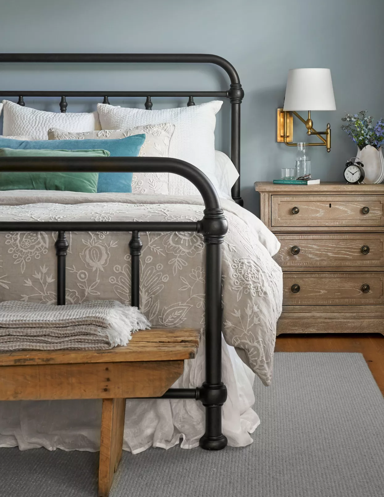 metal-framed bed wooden side table